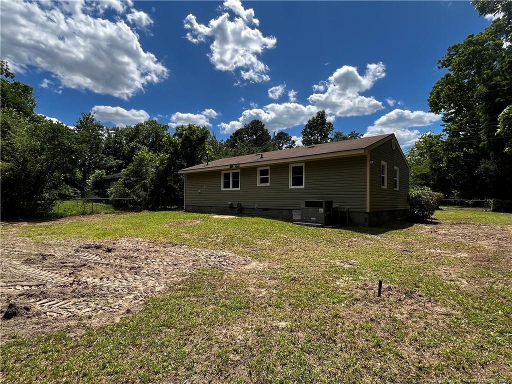 117 Leona Ave, Fayetteville, NC 28314 - rear view of property with crawl space and central AC unit