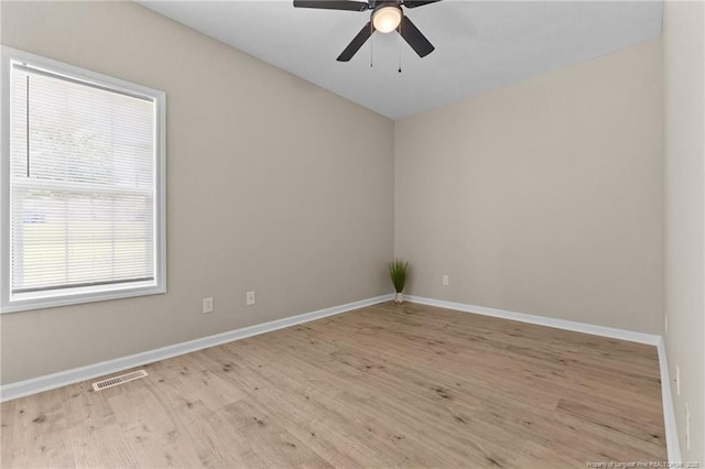 926 Foxhunt Ln, Fayetteville, NC 28314 - unfurnished room with wood finished floors, a ceiling fan, and baseboards