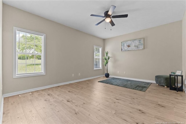 926 Foxhunt Ln, Fayetteville, NC 28314 - unfurnished room with plenty of natural light, baseboards, wood finished floors, and ceiling fan