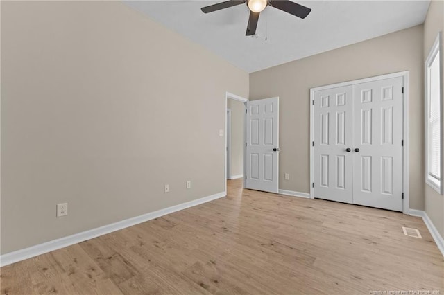 926 Foxhunt Ln, Fayetteville, NC 28314 - unfurnished bedroom featuring light wood-style flooring, baseboards, ceiling fan, and a closet