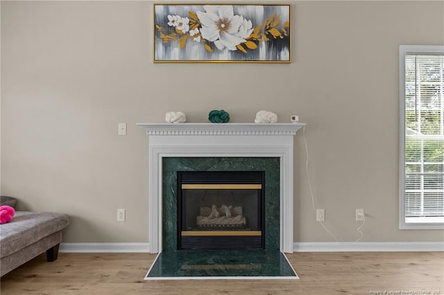 926 Foxhunt Ln, Fayetteville, NC 28314 - detailed view of baseboards, wood finished floors, and a fireplace