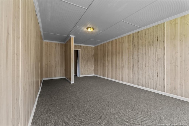 926 Foxhunt Ln, Fayetteville, NC 28314 - additional living space with dark carpet, wood walls, and baseboards