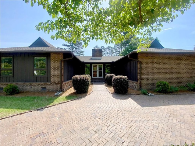 4207 Aldwych St, Lumberton, NC 28358 - single story home featuring brick siding, board and batten siding, and a chimney