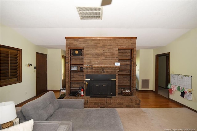 4207 Aldwych St, Lumberton, NC 28358 - living area with baseboards, a fireplace, and carpet floors