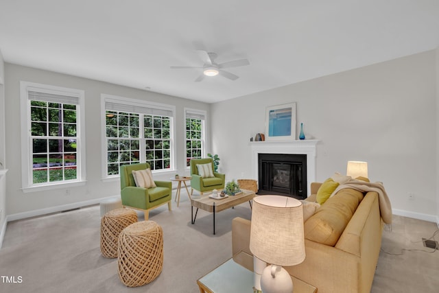 522 N Scotswood Blvd, Hillsborough, NC 27278 - living area featuring ceiling fan, a glass covered fireplace, baseboards, and healthy amount of natural light