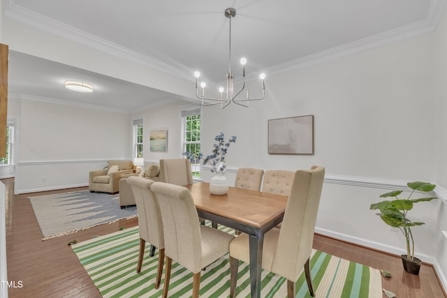 522 N Scotswood Blvd, Hillsborough, NC 27278 - dining area with a chandelier, wood finished floors, ornamental molding, and baseboards