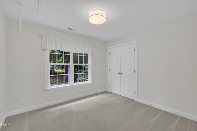 522 N Scotswood Blvd, Hillsborough, NC 27278 - unfurnished bedroom featuring carpet floors, baseboards, attic access, and a closet