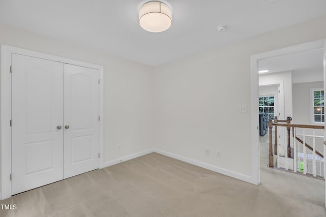 522 N Scotswood Blvd, Hillsborough, NC 27278 - unfurnished bedroom with baseboards, light colored carpet, and a closet
