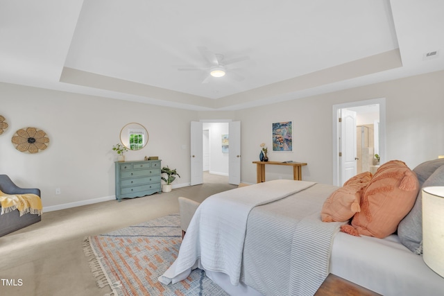 522 N Scotswood Blvd, Hillsborough, NC 27278 - bedroom featuring a tray ceiling, baseboards, carpet flooring, and ensuite bath