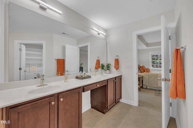 522 N Scotswood Blvd, Hillsborough, NC 27278 - ensuite bathroom with double vanity, tile patterned floors, and baseboards