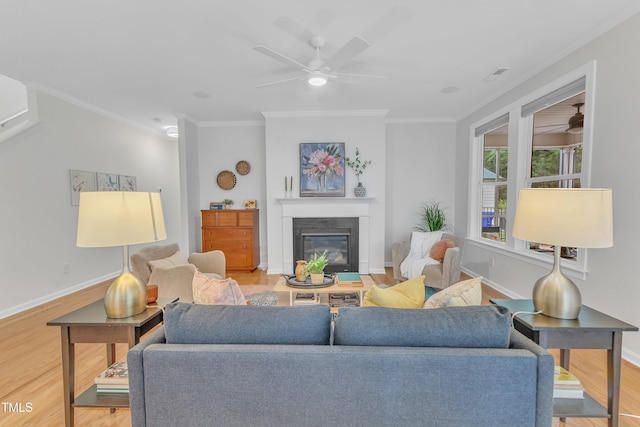 151 Bridge St, Hillsborough, NC 27278 - living area featuring ceiling fan, wood finished floors, a glass covered fireplace, crown molding, and baseboards