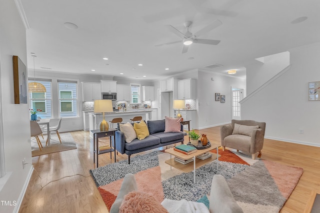 151 Bridge St, Hillsborough, NC 27278 - living area with ornamental molding, a ceiling fan, plenty of natural light, recessed lighting, and baseboards