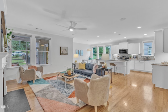 151 Bridge St, Hillsborough, NC 27278 - living room featuring healthy amount of natural light, ceiling fan, light wood-style flooring, recessed lighting, and baseboards