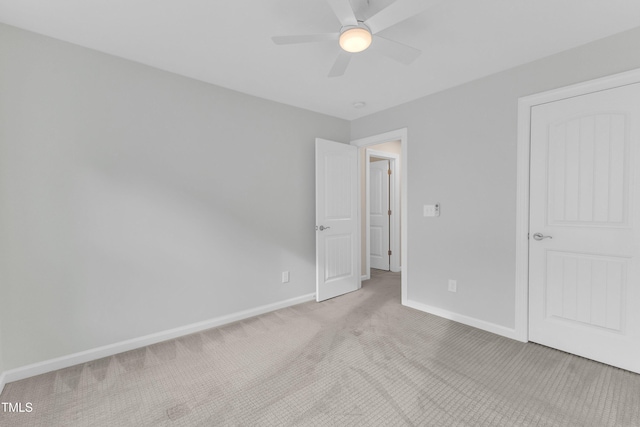 151 Bridge St, Hillsborough, NC 27278 - unfurnished bedroom with light carpet, baseboards, and a ceiling fan