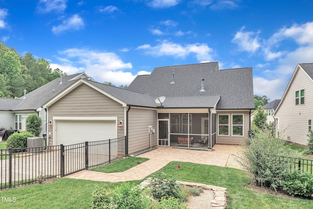 151 Bridge St, Hillsborough, NC 27278 - rear view of property with a garage, a sunroom, roof with shingles, and a patio area