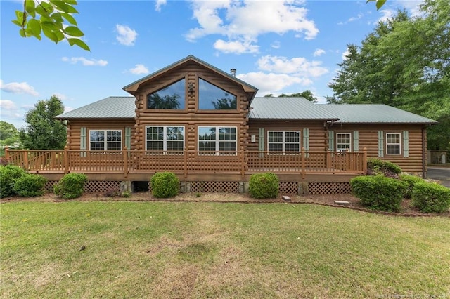 113 Atwood Ter, Stedman, NC 28391 - back of house featuring metal roof, a deck, a lawn, and log siding