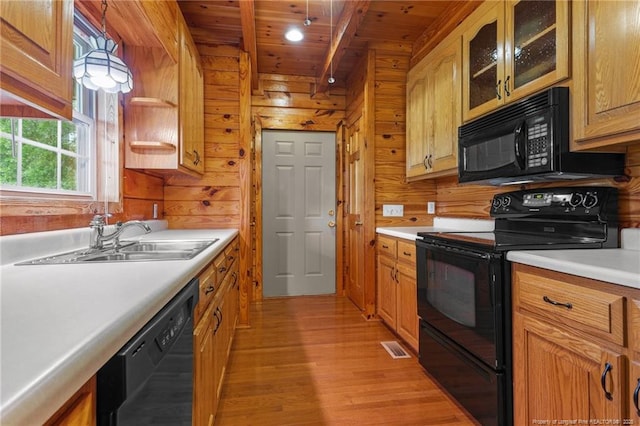 113 Atwood Ter, Stedman, NC 28391 - kitchen with black appliances, wood ceiling with exposed beams, a sink, light wood-type flooring, and wooden walls