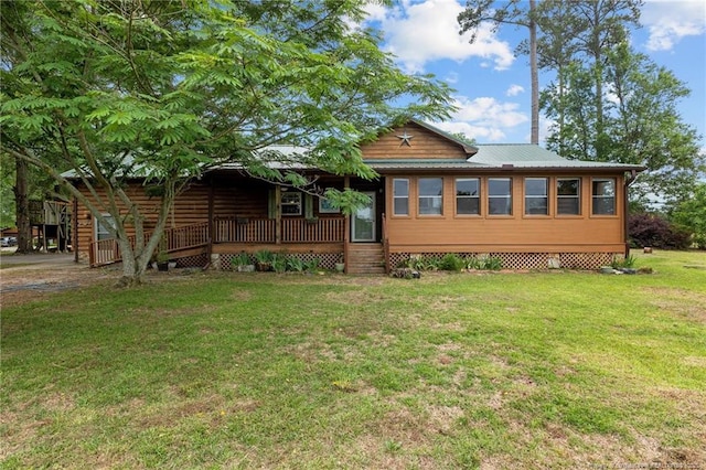 113 Atwood Ter, Stedman, NC 28391 - view of front of property with a front yard, a porch, and metal roof