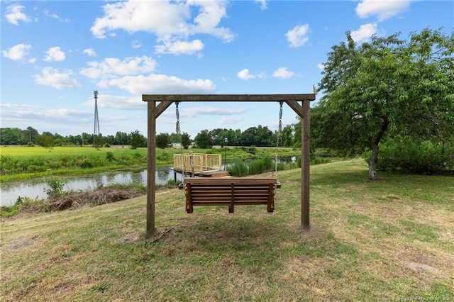 113 Atwood Ter, Stedman, NC 28391 - surrounding community with a lawn and a water view