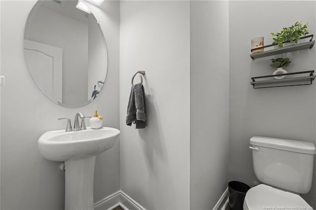 6752 Running Fox Rd, Hope Mills, NC 28348 - bathroom featuring toilet and baseboards
