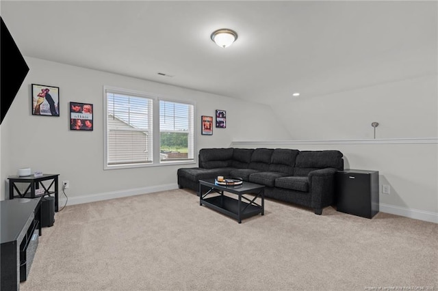 6752 Running Fox Rd, Hope Mills, NC 28348 - carpeted living room featuring baseboards and lofted ceiling