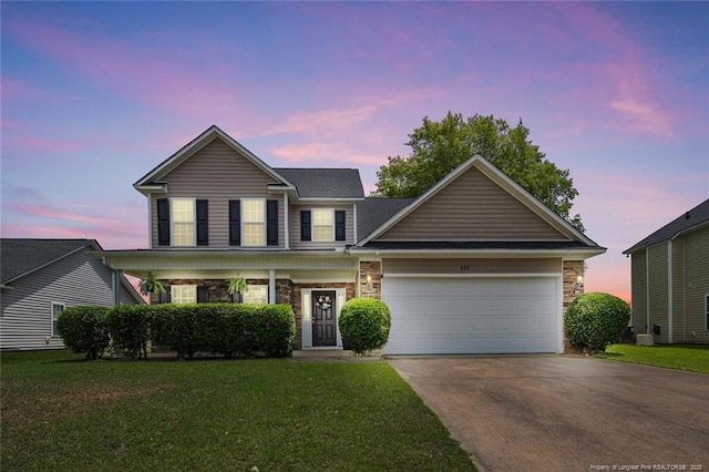 625 Fairfield Cir, Raeford, NC 28376 - traditional-style house featuring stone siding, driveway, a garage, and a lawn