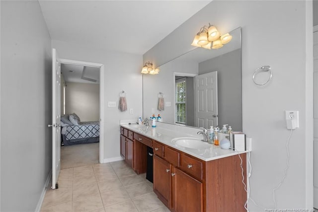 625 Fairfield Cir, Raeford, NC 28376 - ensuite bathroom featuring double vanity, baseboards, and tile patterned flooring
