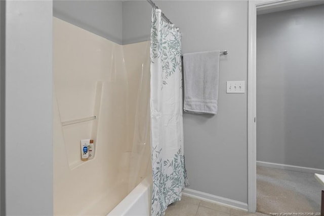 625 Fairfield Cir, Raeford, NC 28376 - bathroom featuring shower / bath combo with shower curtain, baseboards, and tile patterned flooring