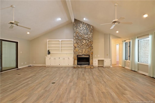750 Mimosa Dr, Vass, NC 28394 - unfurnished living room featuring a ceiling fan, light wood-style floors, a fireplace, beam ceiling, and recessed lighting