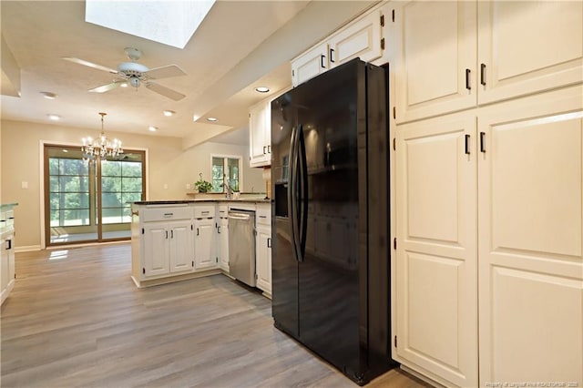 750 Mimosa Dr, Vass, NC 28394 - kitchen featuring black fridge with ice dispenser, dishwasher, a peninsula, light wood-type flooring, and a skylight