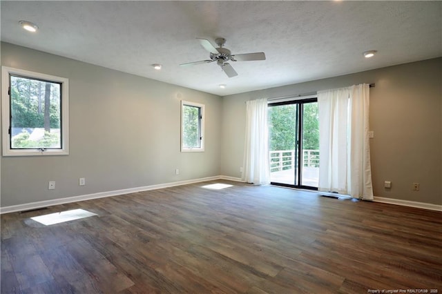 750 Mimosa Dr, Vass, NC 28394 - empty room with baseboards, dark wood-type flooring, a ceiling fan, a textured ceiling, and recessed lighting