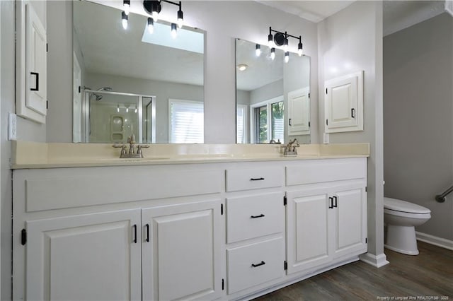 750 Mimosa Dr, Vass, NC 28394 - bathroom with a shower stall, double vanity, wood finished floors, baseboards, and toilet