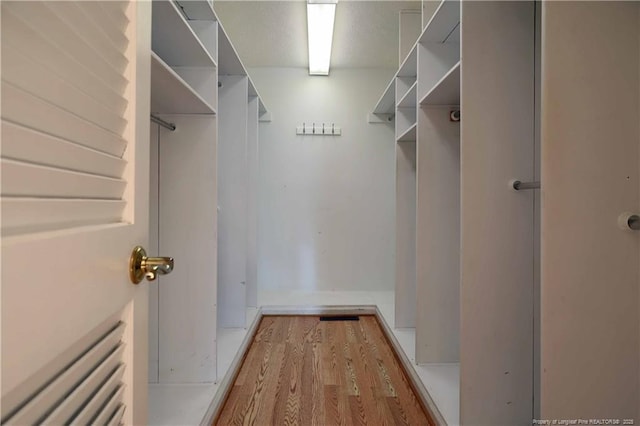 750 Mimosa Dr, Vass, NC 28394 - spacious closet with wood finished floors