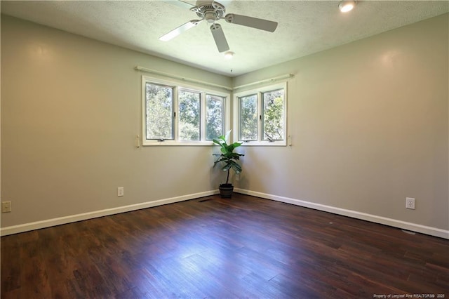 750 Mimosa Dr, Vass, NC 28394 - empty room with wood finished floors, ceiling fan, baseboards, and a textured ceiling