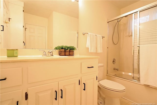 750 Mimosa Dr, Vass, NC 28394 - bathroom featuring toilet, vanity, enclosed tub / shower combo, and tile patterned floors