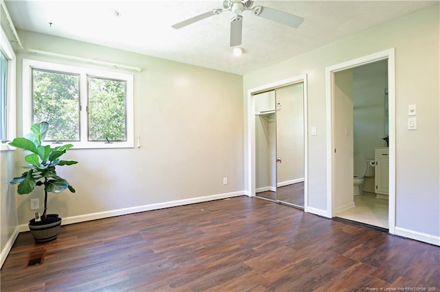 750 Mimosa Dr, Vass, NC 28394 - unfurnished bedroom featuring wood finished floors, baseboards, a closet, and ceiling fan