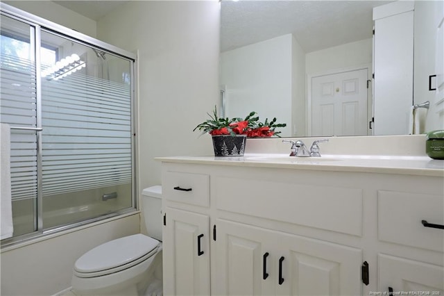 750 Mimosa Dr, Vass, NC 28394 - bathroom with vanity, shower / bath combination with glass door, and toilet