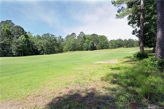 750 Mimosa Dr, Vass, NC 28394 - view of property's community featuring golf course view, a yard, and view of wooded area