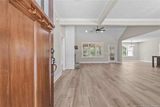 5400 Dowd Rd, West End, NC 27376 - unfurnished living room with a chandelier, light wood-style flooring, ornamental molding, baseboards, and lofted ceiling