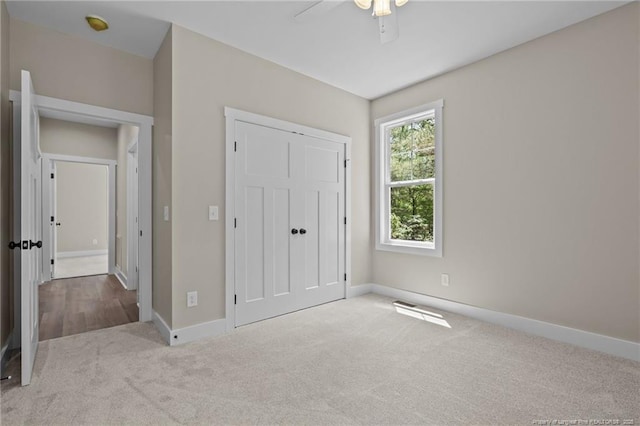5400 Dowd Rd, West End, NC 27376 - unfurnished bedroom with carpet floors, baseboards, a closet, and ceiling fan