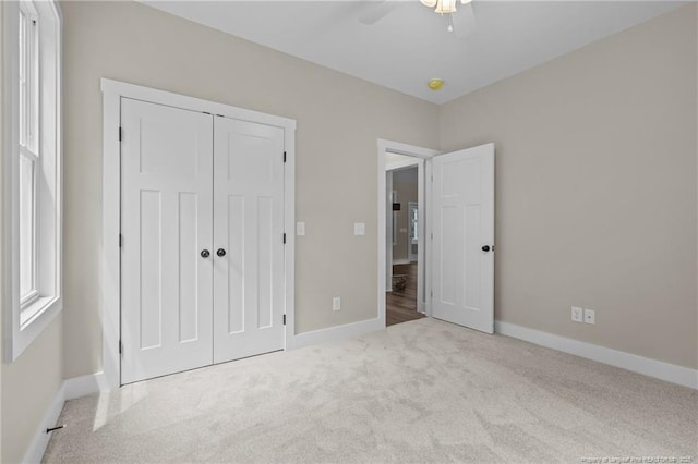 5400 Dowd Rd, West End, NC 27376 - unfurnished bedroom featuring carpet floors, baseboards, a closet, and ceiling fan