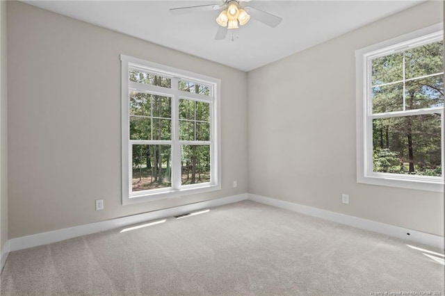 5400 Dowd Rd, West End, NC 27376 - empty room with healthy amount of natural light, ceiling fan, and carpet