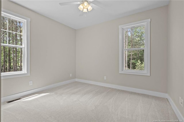 5400 Dowd Rd, West End, NC 27376 - carpeted spare room featuring a ceiling fan and baseboards