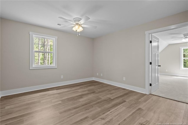 5400 Dowd Rd, West End, NC 27376 - unfurnished room featuring ceiling fan, light wood-style floors, baseboards, and lofted ceiling