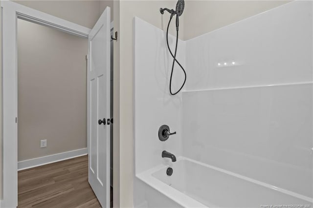 5400 Dowd Rd, West End, NC 27376 - full bathroom featuring bathtub / shower combination, wood finished floors, and baseboards