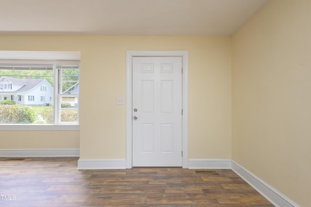 605 E Montgomery St, Henderson, NC 27536 - entrance foyer featuring dark wood-style flooring