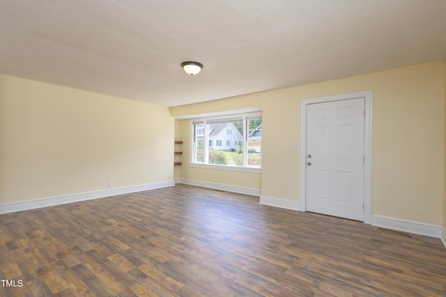 605 E Montgomery St, Henderson, NC 27536 - spare room with dark wood finished floors
