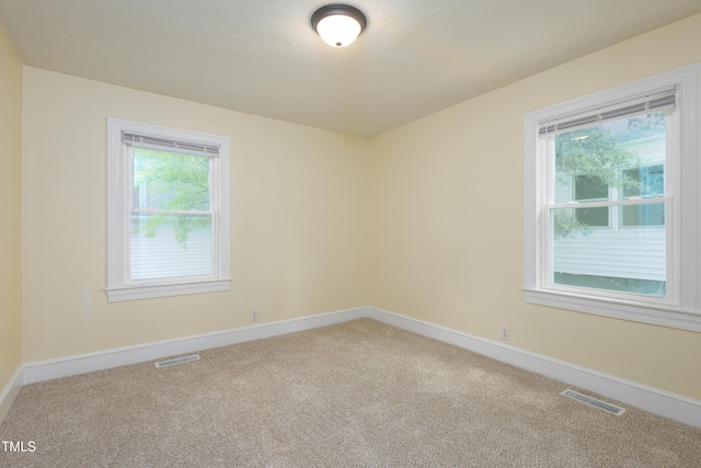 605 E Montgomery St, Henderson, NC 27536 - unfurnished room featuring carpet flooring and baseboards