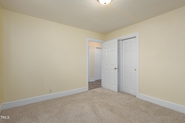 605 E Montgomery St, Henderson, NC 27536 - unfurnished bedroom with carpet floors and a closet