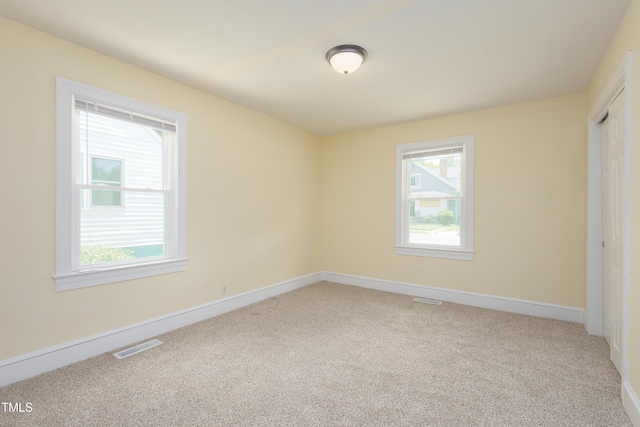 605 E Montgomery St, Henderson, NC 27536 - unfurnished bedroom featuring carpet flooring and a closet